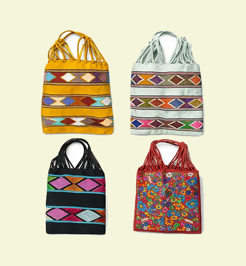 Four colorful handbags with geometric and floral patterns on a beige background