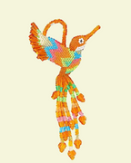 Colorful beaded hummingbird ornament on a beige background