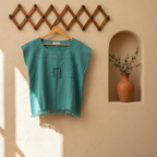 Green top with a textured pattern on a beige background, featuring the brand 'Raices Thread'.